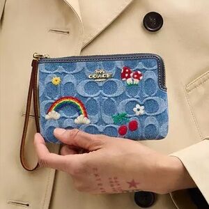 Coach Corner Zip Wristlet
In Signature Denim Embroidery